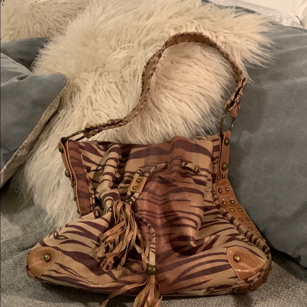 Tiger striped suede bag with brass studs.